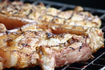 delicious food pork grilling on hot charcoal