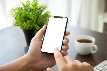 man hands holding phone with isolated screen in office