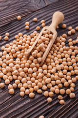 uncooked chickpeas on a wooden rustic background