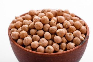 uncooked chickpeas on a white acrylic background