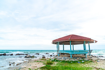 wood pavilion with beach and sea background