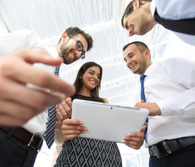 Fototapeta premium closeup of business team looking at digital tablet.