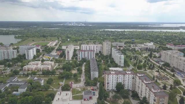 Residential multi-storey houses and buildings in the city of Netishin near Khmelnitsky nuclear power plant in Ukraine. Aerial view. Summer day with a cloudy sky