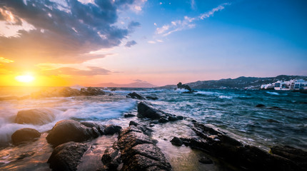 Beautiful seascape with rocks and waves at sunset