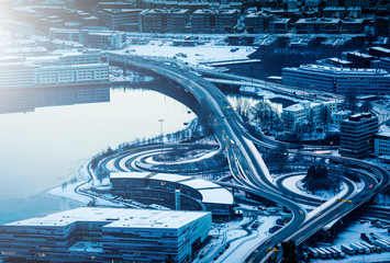 view from the mountains to Bergen in winter, city with roads, Norway