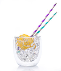 glass with cold water with ice and lemon isolated on a white background