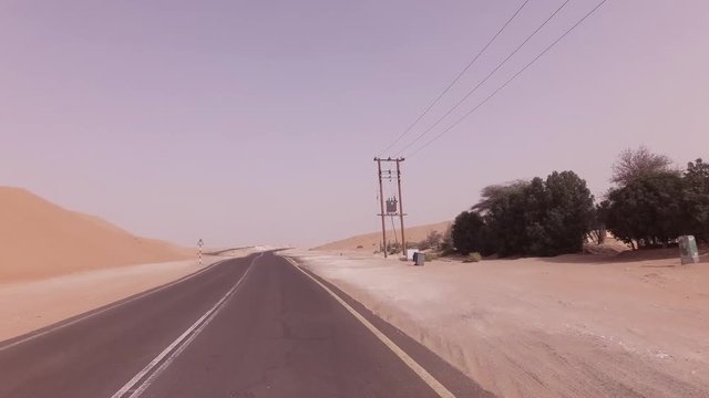 New road from Oasis Liwa to Moreeb Dune in Rub al Khali desert stock footage video
