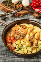 Braised pork chop with mushrooms.