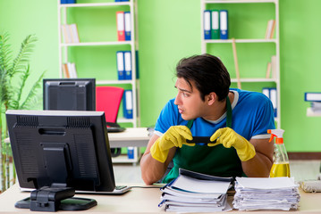 Male spy under cleaner cover stealing confidential documents