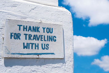 Grateful sign on a stone wall at Greece pier