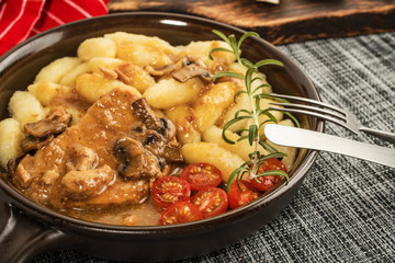 Braised pork chop with mushrooms.