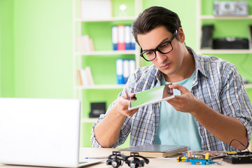 Computer engineer repairing broken desktop