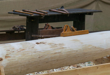 Сarpentry skills, plane on a log, carpenter work