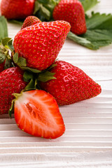 Juicy fresh strawberry on a rustic wooden background