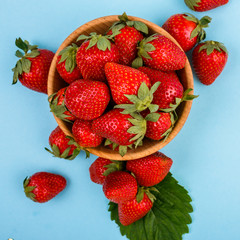 juicy fresh strawberry on a delicately blue background