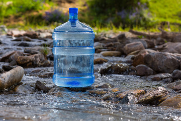 Natural mineral water in a large bottle - 217665872