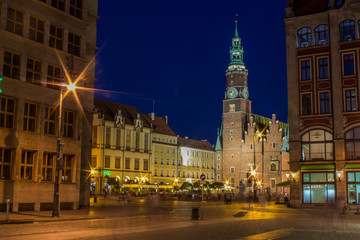 soft focus night long exposure concept of old medieval city scape square view with catholic church...