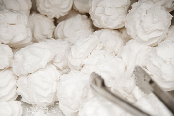 vanilla marshmallow from russia. white airy delicacy with sugar is sold by weight