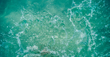 Splashes in the shallow water at the beach