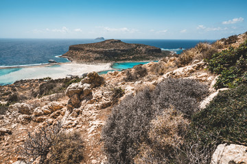 View of the beautiful beach in Balos Lagoon, and Gramvousa island on Crete, Greece. Sunny day, blue Sky with clouds.