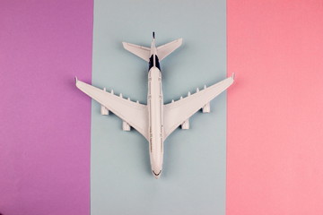 Plane, aircraft on color background. Travel concept. Empty space for text and design.