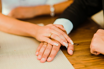The bride and groom holding hands