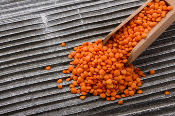 raw lentils on a wooden rustic background