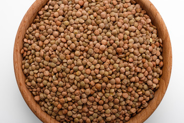 raw lentils on a white acrylic background