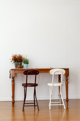 There are various funitures in the livingroom where has a large floor made of wood. Interior of here is bright and clean because of white color wall and good natural light.