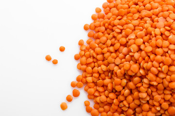 raw lentils on a white acrylic background