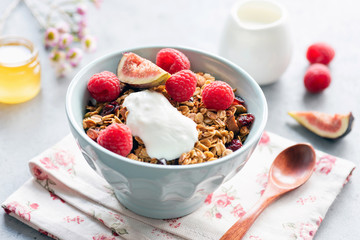 Homemade crunchy granola with yogurt and fruits in bowl. Healthy breakfast, healthy eating concept