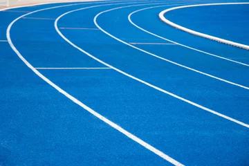 Foto op Plexiglas running track blue color - For fitness or competition Bangkok of Thailand © piyaphunjun