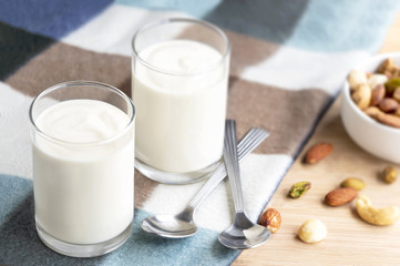 Yogurt in two glasses with dried fruit is a healthy breakfast.