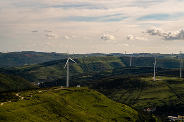 Wind turbine over the mountains