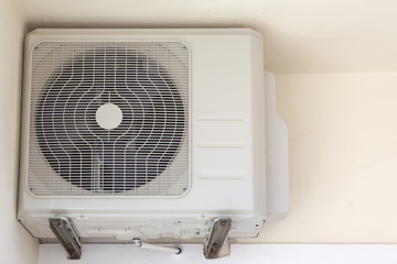 Outdoor air conditioner compressor unit on a wall