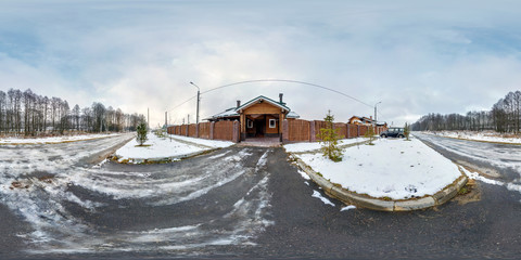 panorama 360 degrees angle view near gate of  wooden vacation house in the winter cloudy day in equirectangular projection, skybox VR AR content