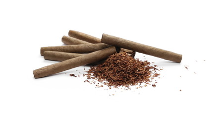 Cigarillos and tobacco pile isolated over white background