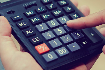 Fototapeta na wymiar close up business woman hand pressing on calculator for working as accountant cocnept
