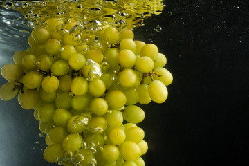 Grapes in water with reflection