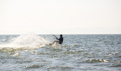 Fototapeta premium Kite surfing by the sea in sunny weather