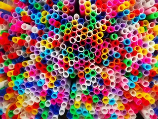 Multicolored plastic sticks for bundles of balloons taken from above. 