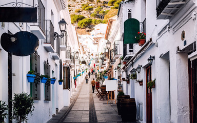 Fototapeta premium Charming whitewashed street of Mijas village. Costa del Sol. Spain