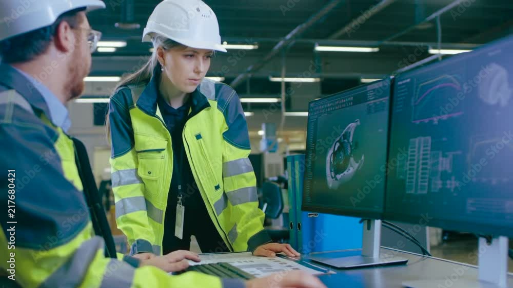 Poster inside factory male mechanical engineer and female chief engineer work together on the personal comp