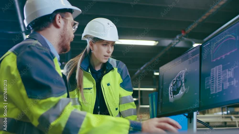 Poster inside factory male mechanical engineer and female chief engineer work together on the personal comp