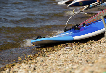 Windsurfing by the sea on the waves