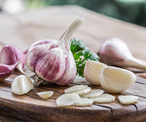 Garlic bulb and garlic cloves  on the wooden table.