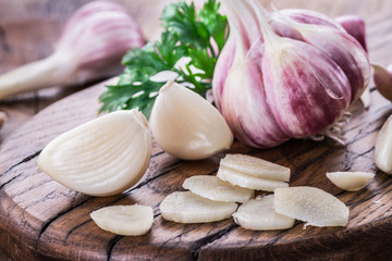 Garlic bulb and garlic cloves  on the wooden table.