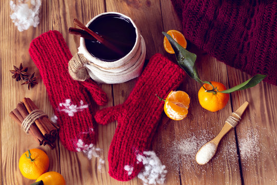 warm winter with mittens, tea and tangerines