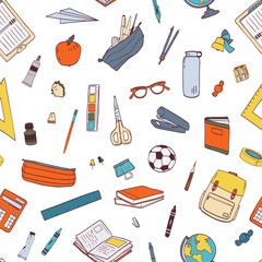 Seamless pattern with school stationery and tools for learning, studies, education. Knowledge day or 1 September backdrop. Colored vector illustration in realistic style for wrapping paper, wallpaper.
