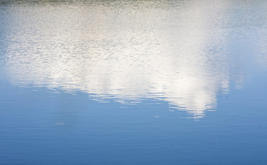Fototapeta na wymiar The reflection of the sky in the lagoon.